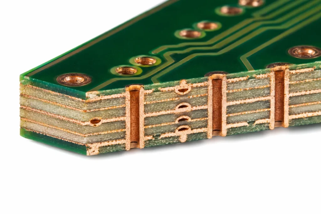 Macro cross-section of a bare multilayer PCB showing internal copper traces, plated via holes, and green solder mask layers on a clean white background.